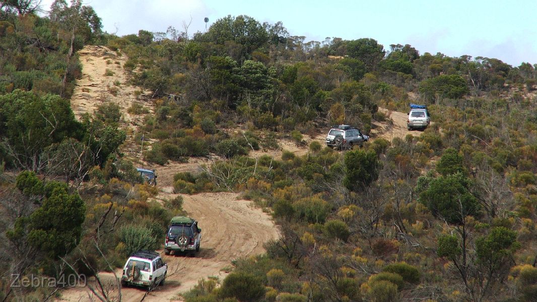 19-Convoy tackles a Border Track dune.JPG